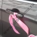 Розовые ленты на ручки дверей авто